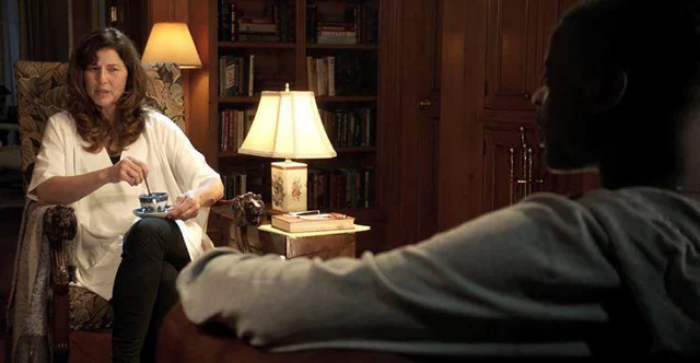 Missy Armitage twirling a spoon inside a china cup